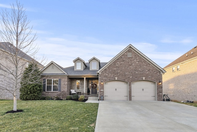 view of front of home featuring brick siding, a garage, driveway, and a front yard