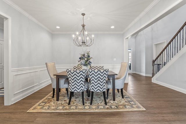 dining space featuring wood finished floors, recessed lighting, an inviting chandelier, crown molding, and stairs