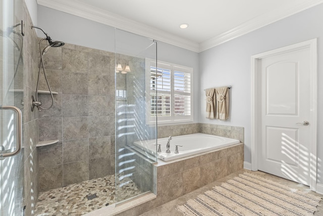 bathroom featuring tile patterned flooring, crown molding, a garden tub, and a shower stall