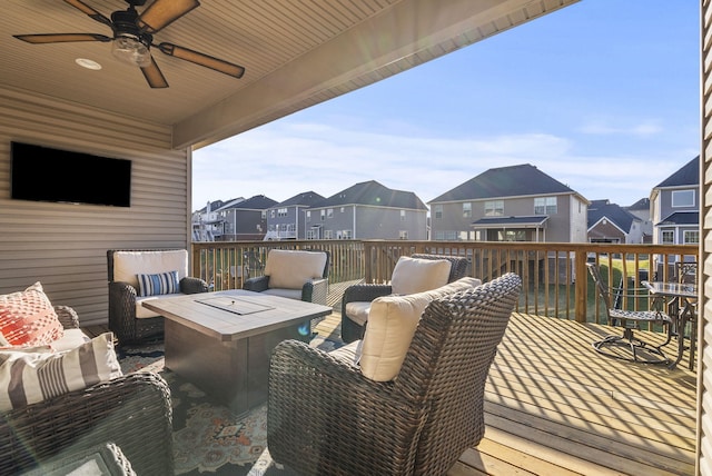 deck featuring a residential view, ceiling fan, and outdoor lounge area