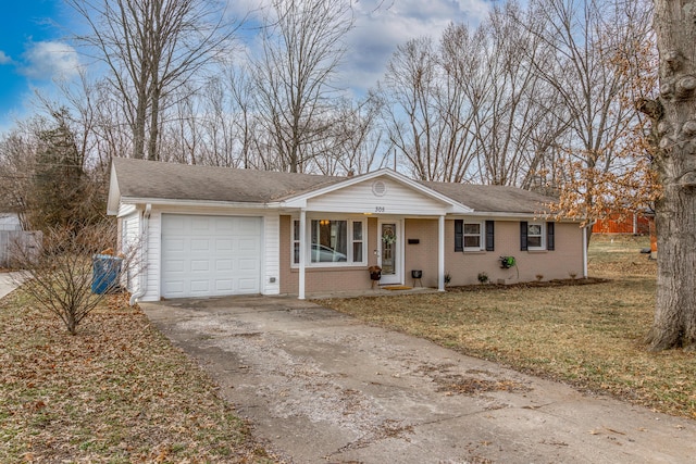 ranch-style home with a front yard, brick siding, a garage, and driveway