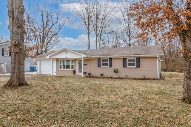 ranch-style house featuring a front yard, an attached garage, brick siding, and driveway