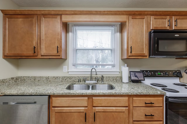 kitchen featuring brown cabinetry, electric range, a sink, black microwave, and dishwasher