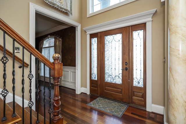 entryway featuring stairway, baseboards, and wood finished floors