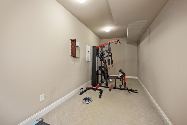 workout room with carpet and baseboards