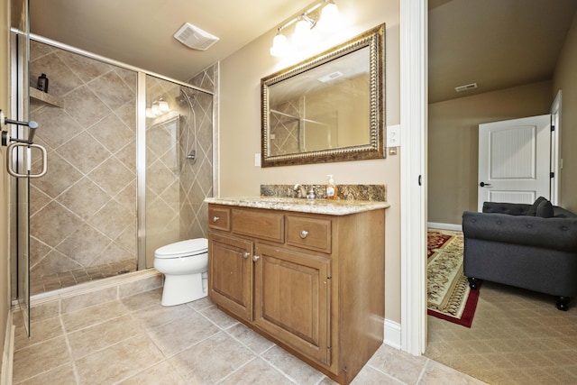 bathroom featuring a shower stall, toilet, and visible vents