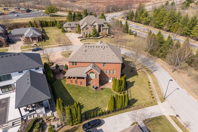 birds eye view of property with a residential view