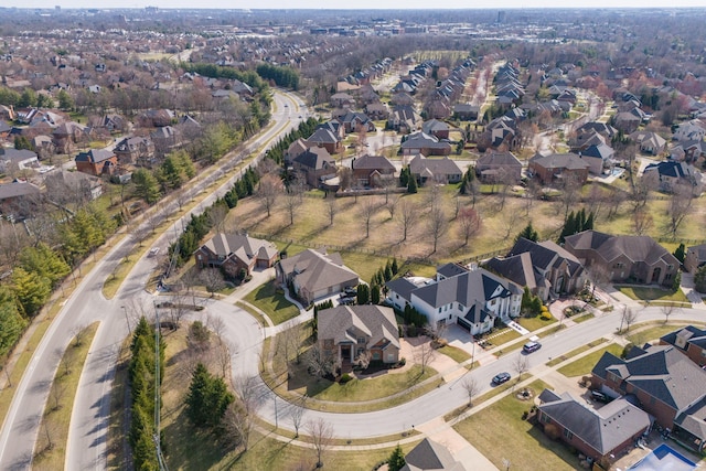 birds eye view of property with a residential view