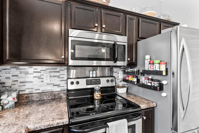 kitchen with tasteful backsplash, dark brown cabinets, and stainless steel appliances