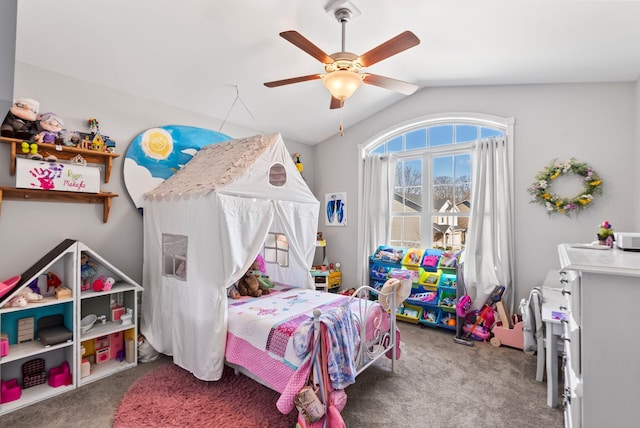 bedroom with vaulted ceiling, a ceiling fan, and carpet floors