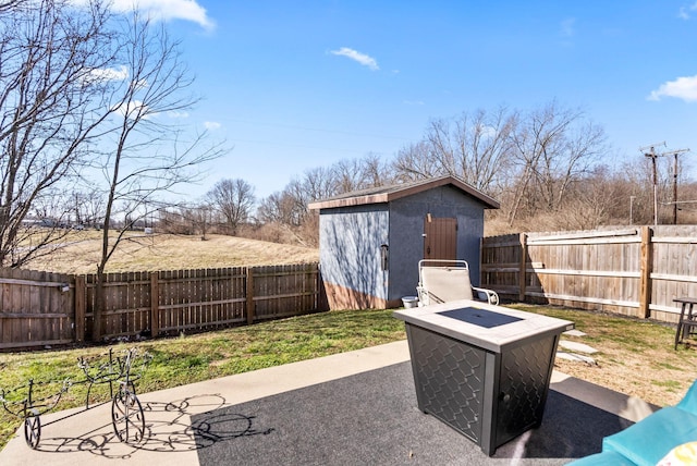 view of patio with a fenced backyard, a shed, and an outdoor structure