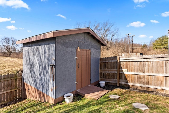 view of shed featuring a fenced backyard