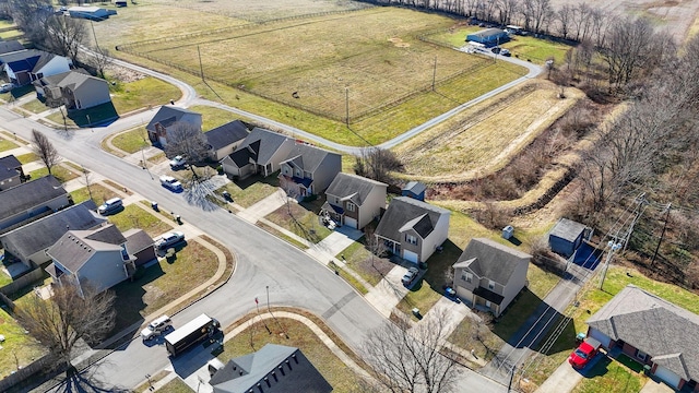 birds eye view of property with a rural view and a residential view