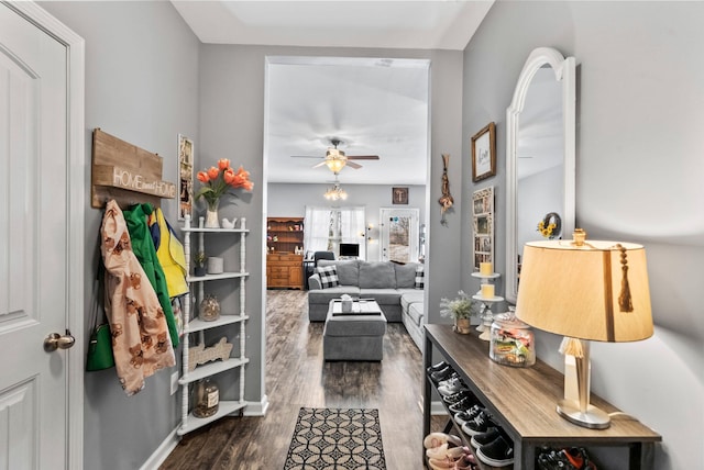 interior space featuring dark wood-type flooring and ceiling fan