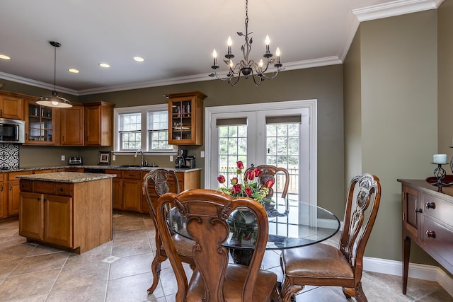 dining space featuring crown molding, light tile patterned flooring, an inviting chandelier, french doors, and recessed lighting