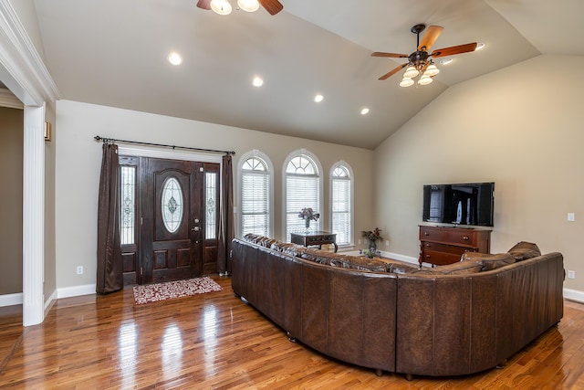 living room with vaulted ceiling, light wood-type flooring, ceiling fan, baseboards, and recessed lighting