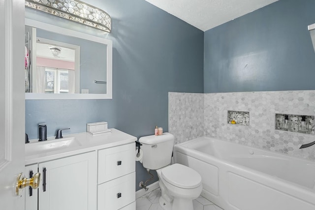 full bathroom with vanity, a garden tub, toilet, and baseboards