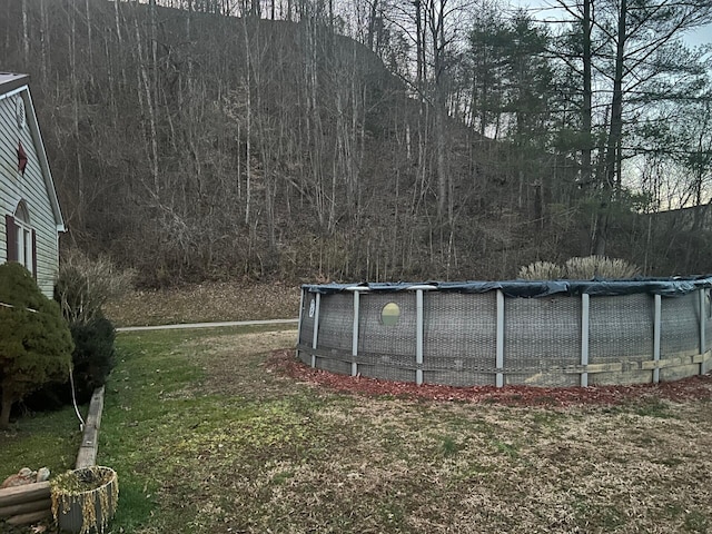 view of yard featuring an outdoor pool