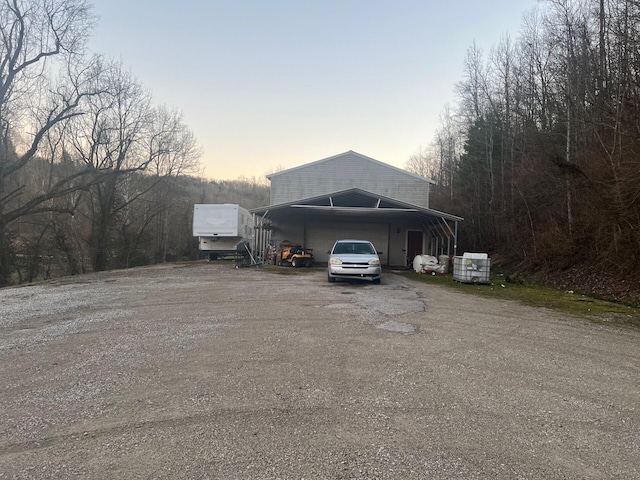 exterior space with an outbuilding and driveway