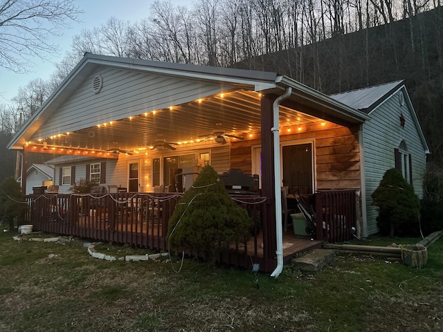 rear view of property with a deck