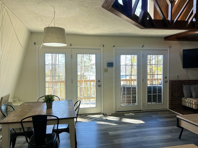 interior space featuring wood finished floors and a textured ceiling