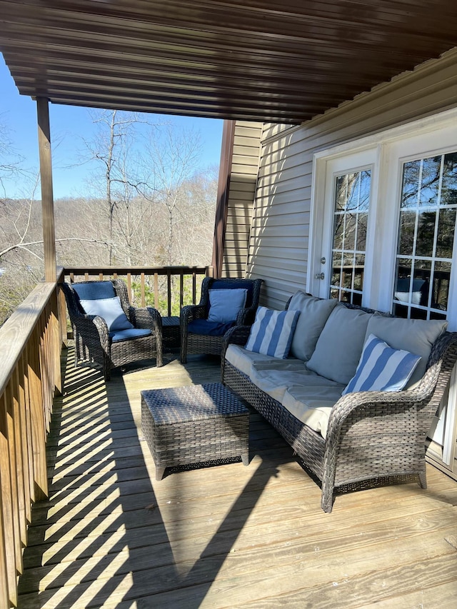 deck with an outdoor hangout area