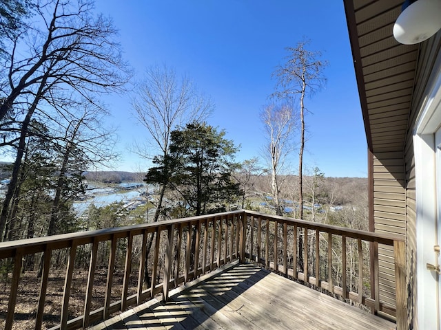 wooden deck featuring a water view