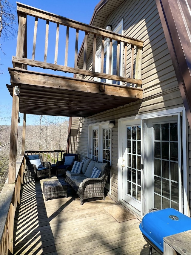 wooden deck featuring an outdoor hangout area