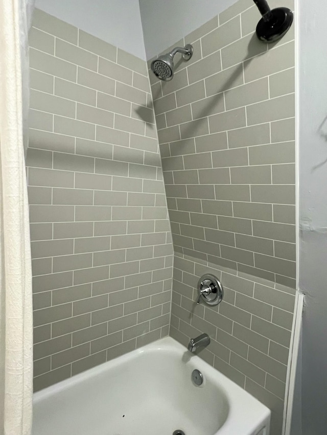 full bathroom with shower / bath combo