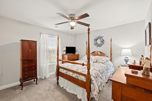 bedroom with visible vents, light carpet, baseboards, and a ceiling fan