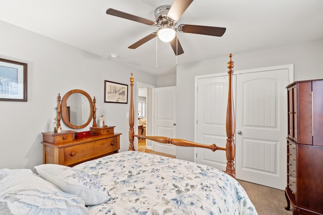 carpeted bedroom with a ceiling fan and visible vents