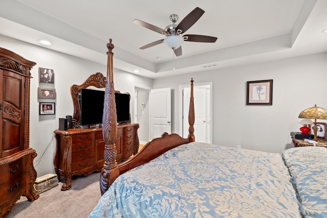 carpeted bedroom with visible vents, recessed lighting, a raised ceiling, and ceiling fan