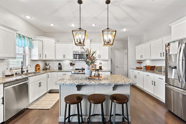 161 Tuscany Way, Richmond, KY 40475 - kitchen with stainless steel appliances, tasteful backsplash, a center island, white cabinets, and recessed lighting