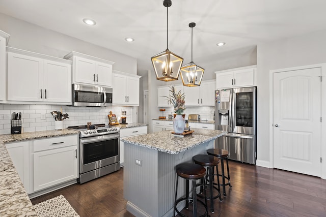 161 Tuscany Way, Richmond, KY 40475 - kitchen with stainless steel appliances, dark wood finished floors, white cabinets, and recessed lighting