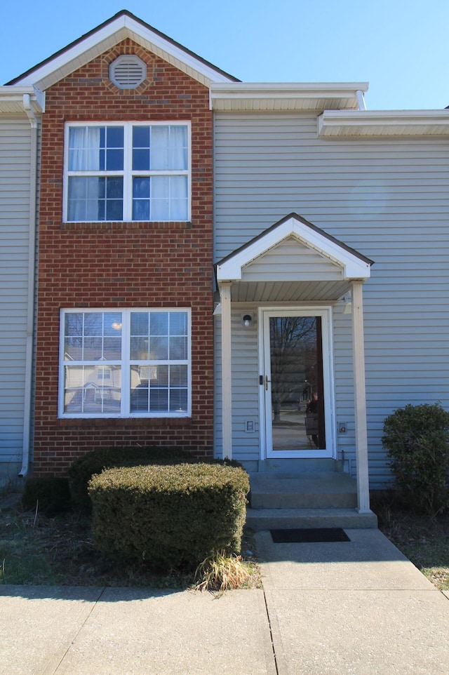 view of front of home with brick siding