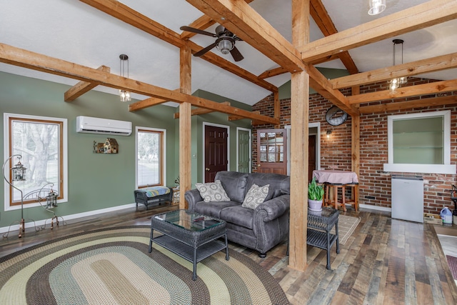 living area featuring beamed ceiling, brick wall, a wall unit AC, and hardwood / wood-style flooring