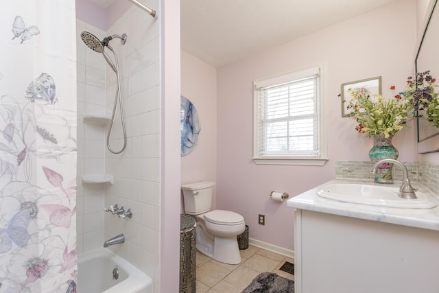 bathroom with tile patterned floors, toilet, shower / bath combo, baseboards, and vanity