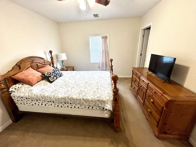 bedroom featuring a ceiling fan, carpet flooring, baseboards, and visible vents