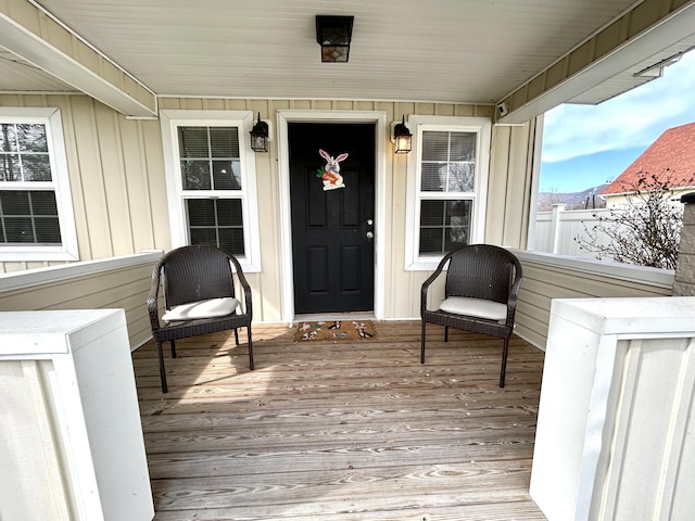 property entrance with a porch and board and batten siding