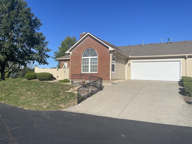 ranch-style house with brick siding, fence, a chimney, a garage, and driveway