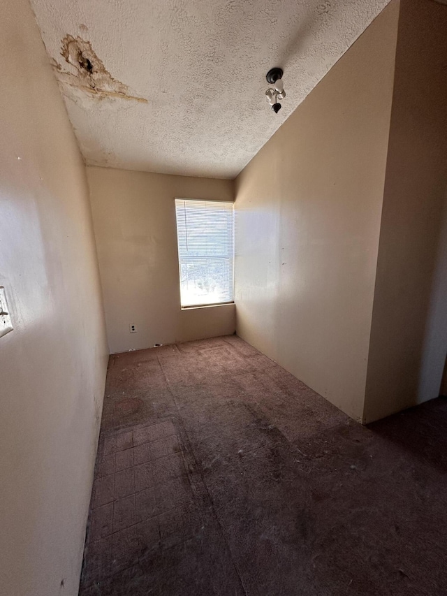 empty room with a textured ceiling