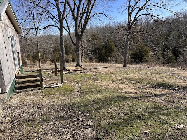 view of yard with a wooded view