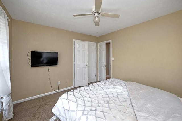 carpeted bedroom featuring ceiling fan and baseboards