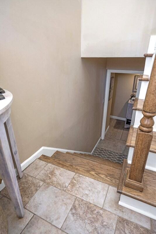 interior space featuring baseboards and stone finish floor