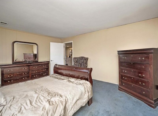 bedroom with visible vents and carpet