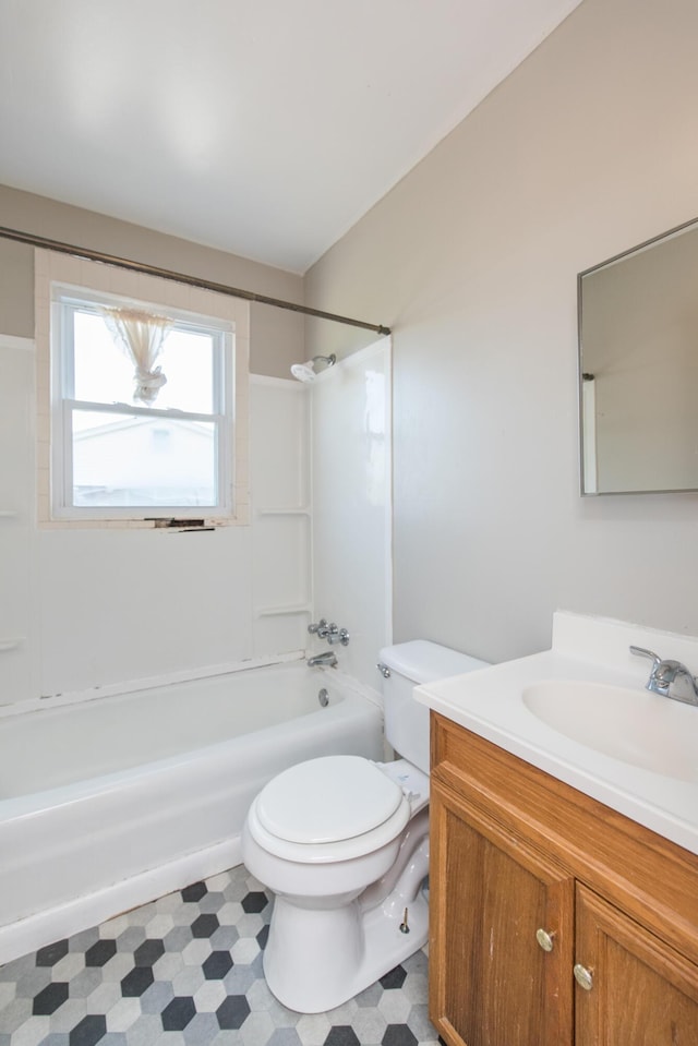 full bathroom featuring vanity, tile patterned floors, toilet, and shower / bathtub combination