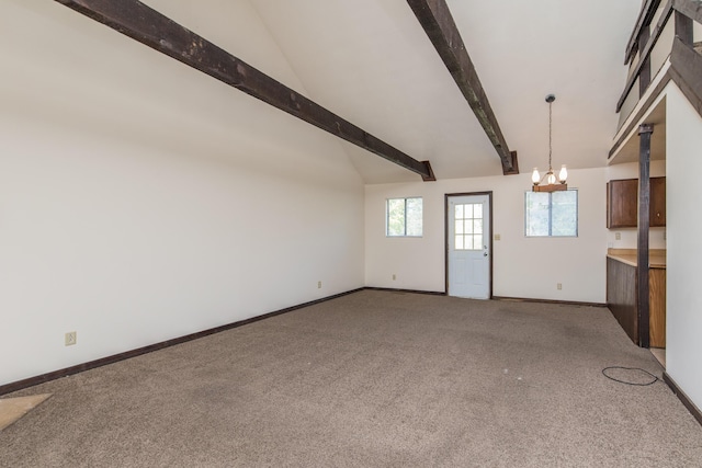 interior space featuring lofted ceiling with beams, baseboards, carpet floors, and an inviting chandelier