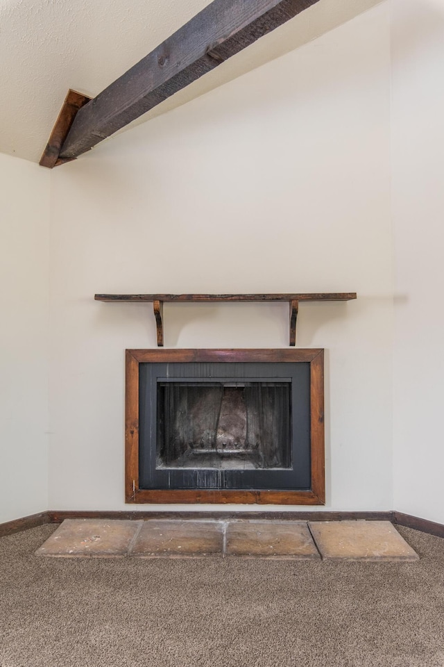 details with baseboards, a fireplace, and carpet flooring