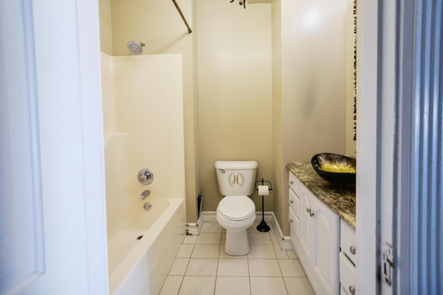 full bath with tile patterned floors, toilet, baseboards, bathing tub / shower combination, and vanity