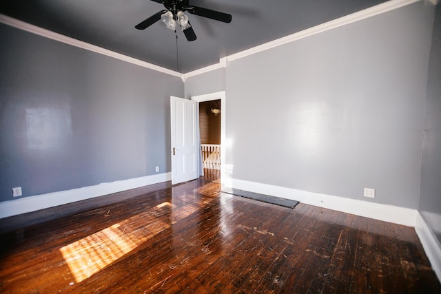 empty room featuring baseboards, crown molding, a ceiling fan, and wood-type flooring